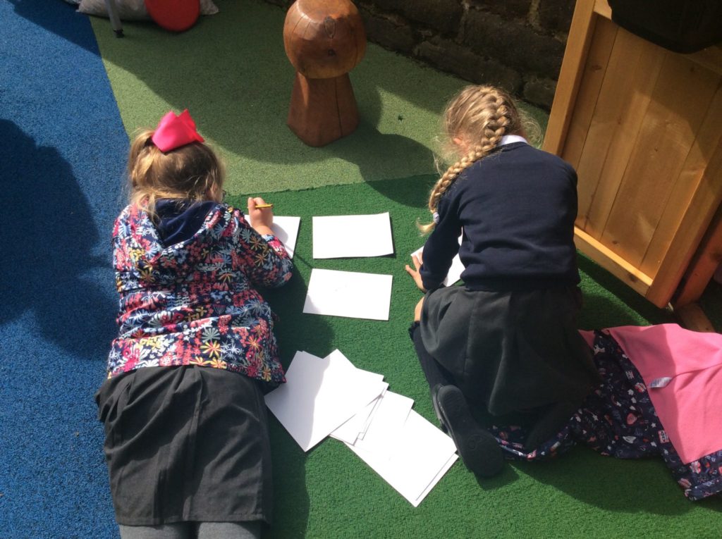 Children creating tickets for their drum show.