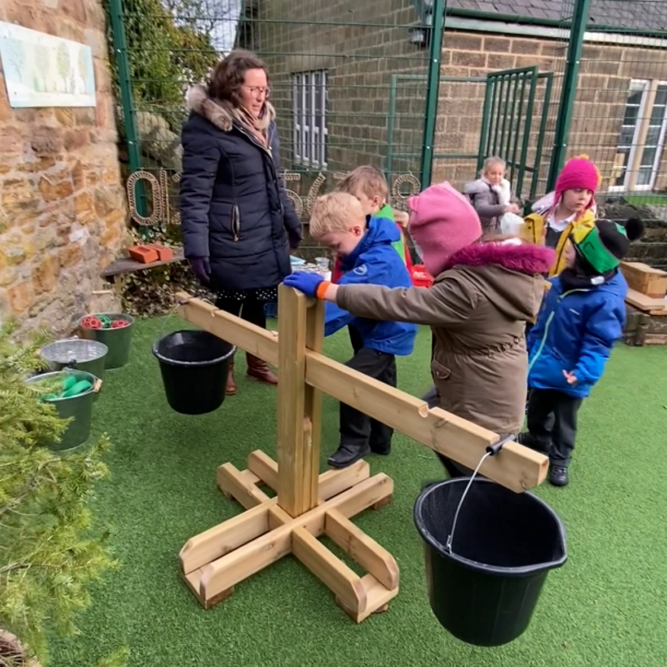 Children use the Giant Wooden Scales.