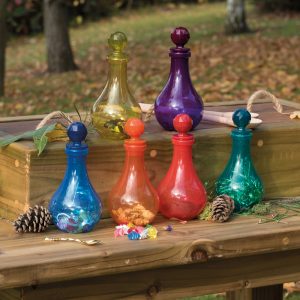Tuff Tray potion mixing with colourful potion bottles