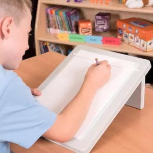 Child using a writing slope