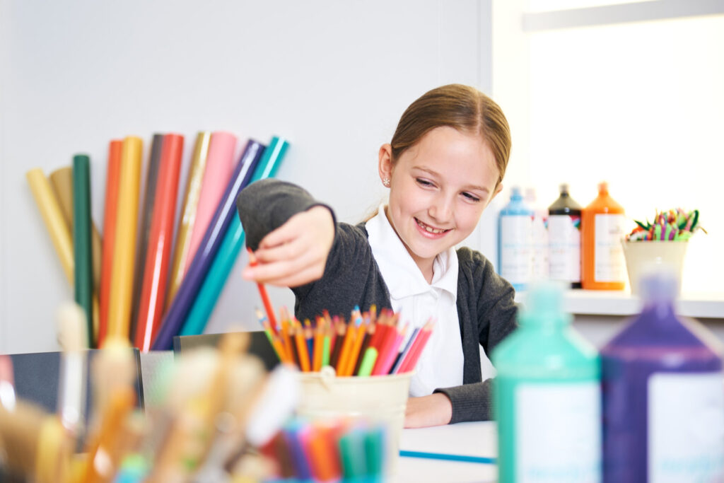 Girl using school stationery