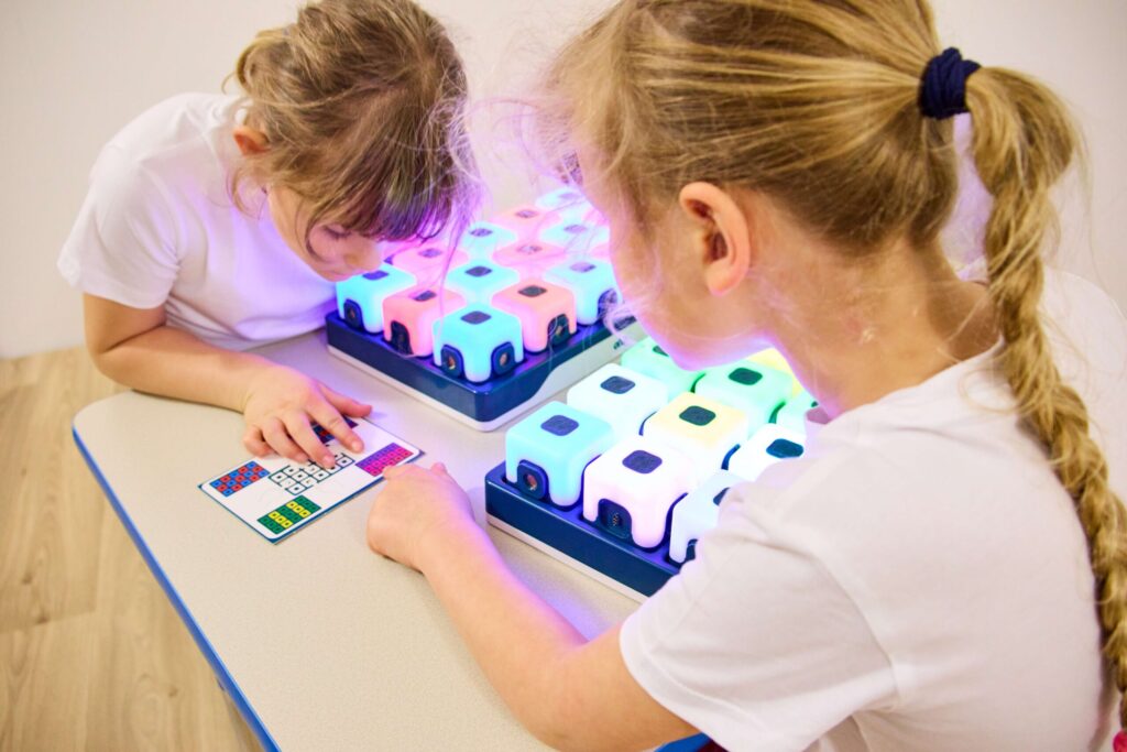 Children using Glow Sequencing Cubes