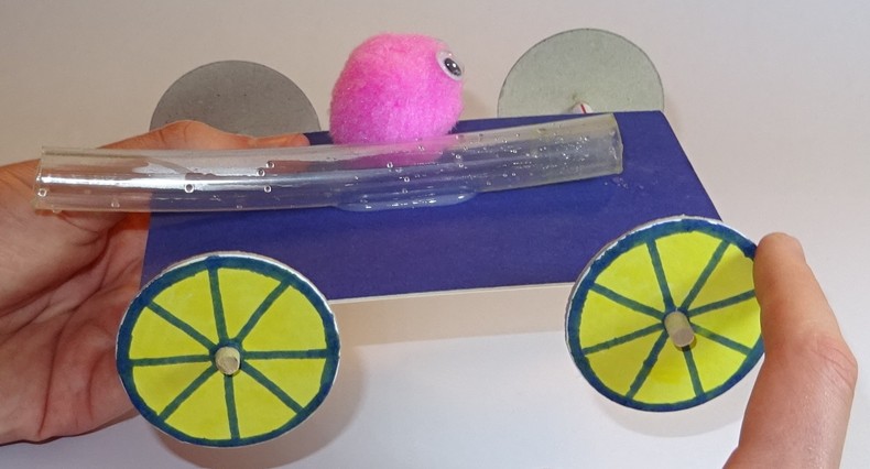 Image shows a balloon buggy without the balloon attached. 