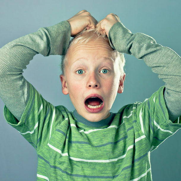 Boy pulling at his hair