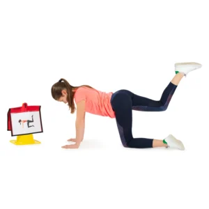 Child practising a balancing position, as shown on a picture in a cross-curricular cone folder.