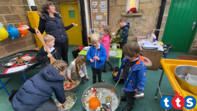 Children mixing their potions with different sized spoons