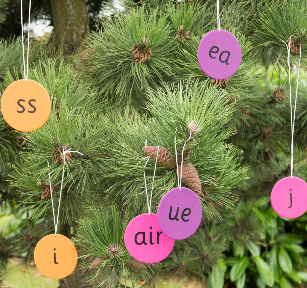 Silicone Phonics Mats hanging in a tree