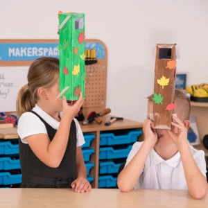 Image shows two school children holding and using homemade periscopes