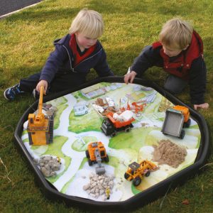 Tuff Tray messy play making tracks with mud, sand and vehicles