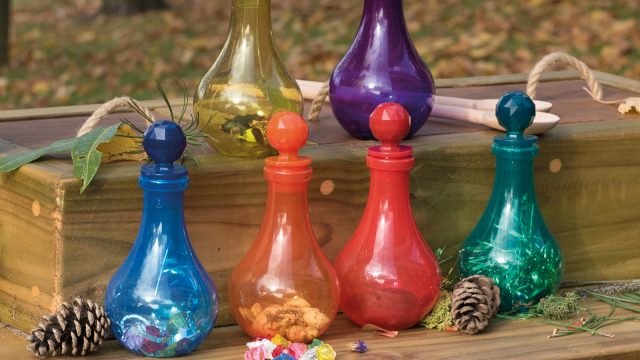 Tuff Tray potion mixing with colourful potion bottles