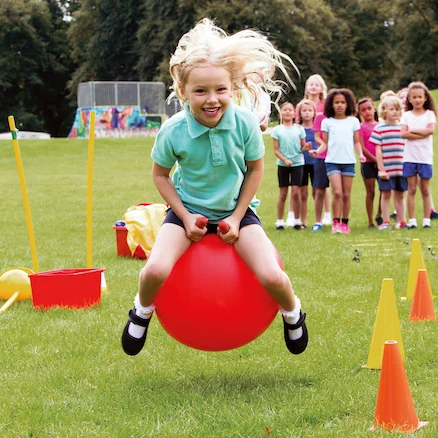 Child on space hopper on sports day