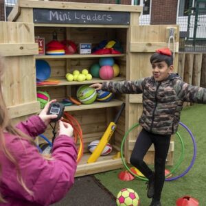 Outdoor Learning activity balancing a beanbag on head.