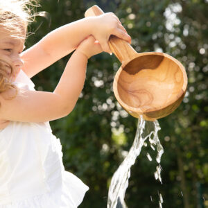 water common play behaviour with wooden spoon 
