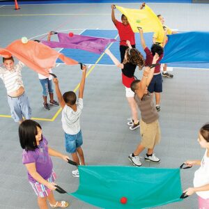 Images shows a diverse range of children using two person parachutes.