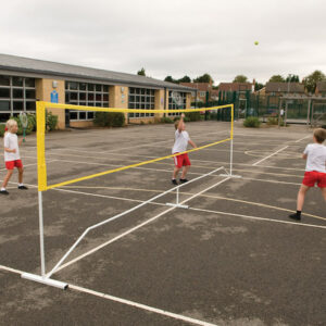 Children using tennis net