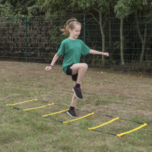 Girl on agility ladder