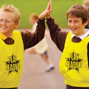 Sport leaders wearing play leader bibs