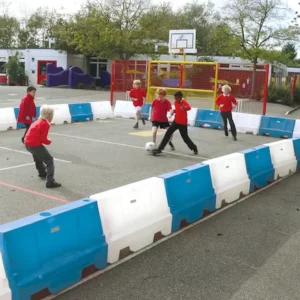 Children playing football using playground game dividers.