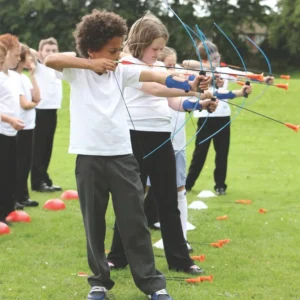 School children playing archery