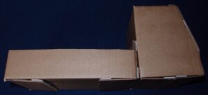 Cardboard shaped as a cabin for a carnival float