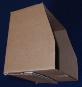 Cardboard box shaped like a cabin